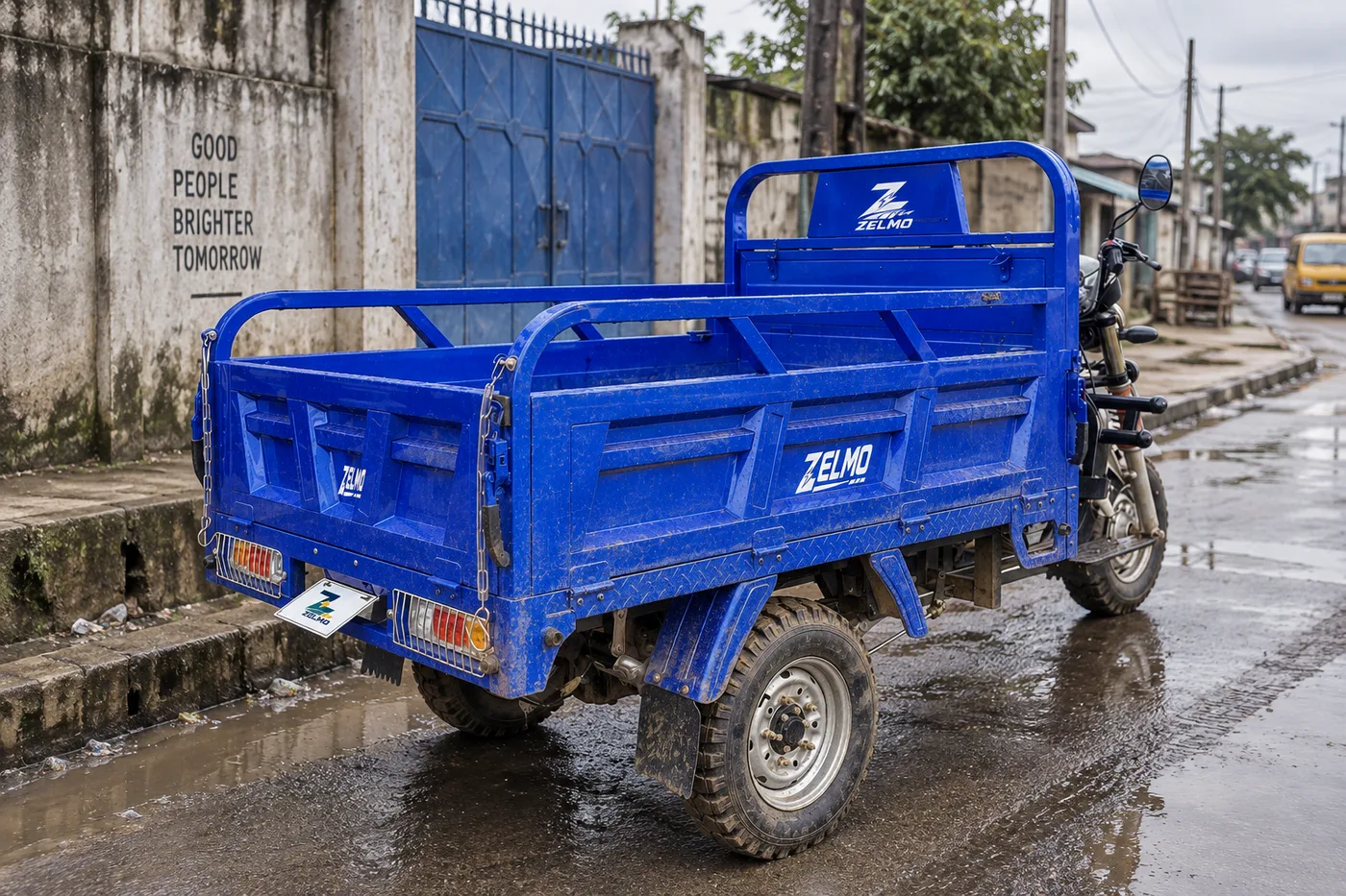 ZELMO open cargo body blue rear three-quarter view · After the rain